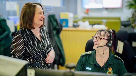 Paramedic workers discussing in a office