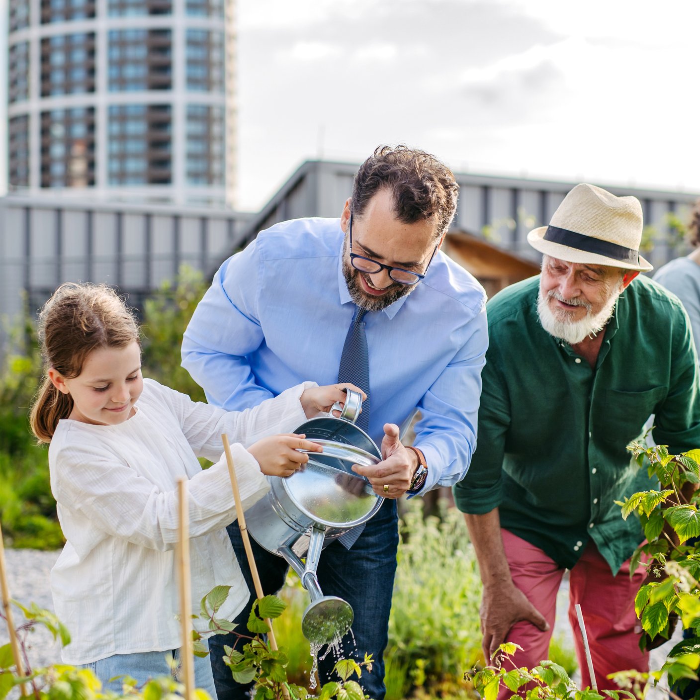 Neighbours taking care together of their community garden