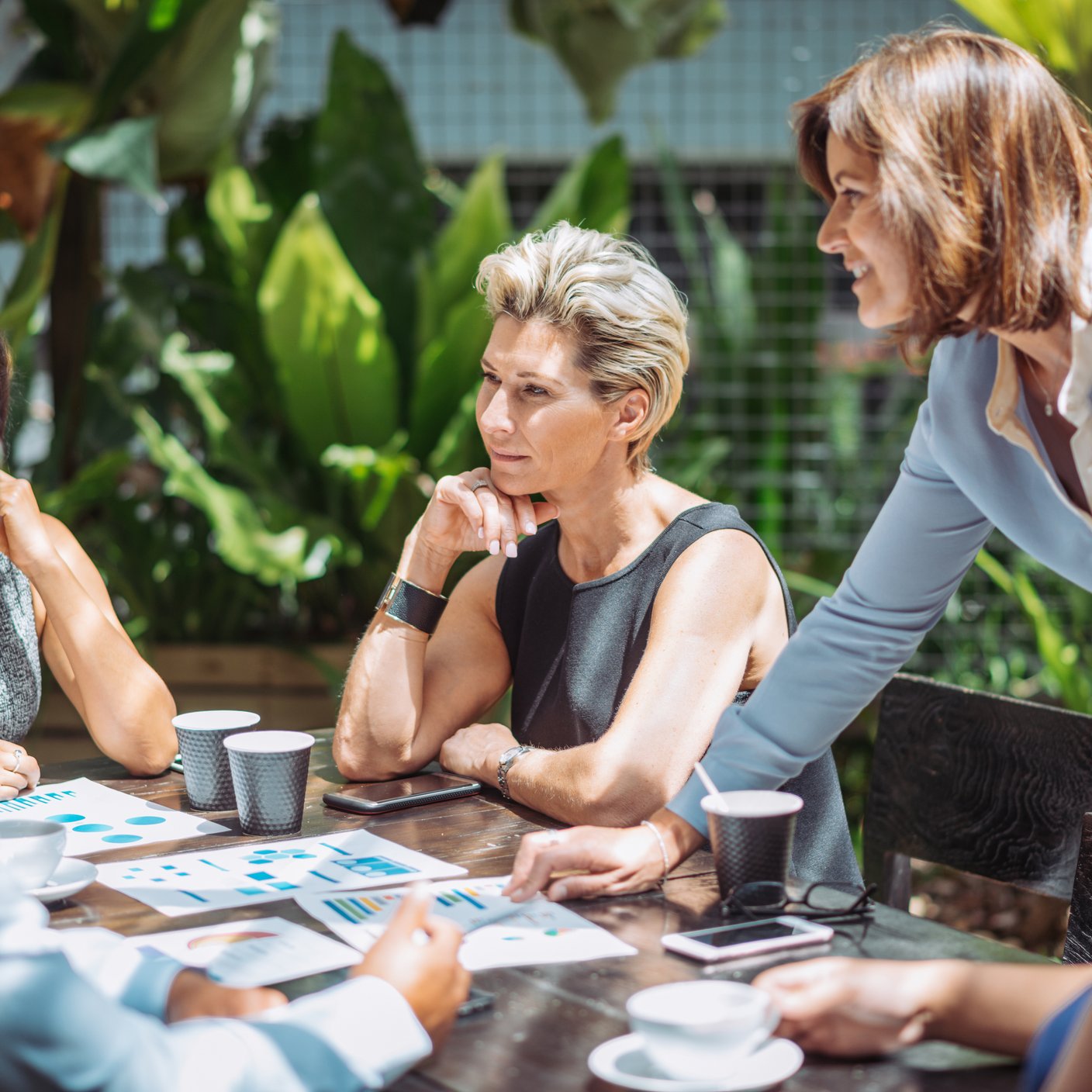 Female boss is finding solutions to overcome the existing problems in company. 