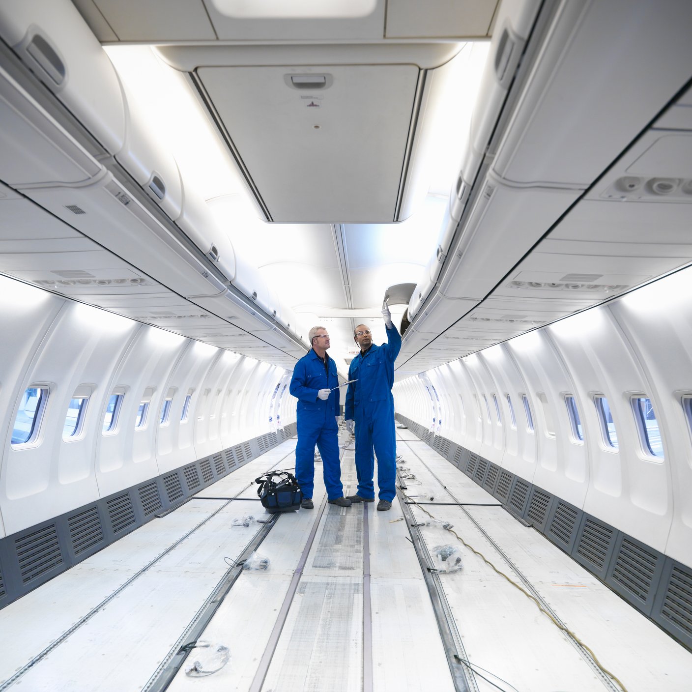 Image of two engineers perform checking in aircraft