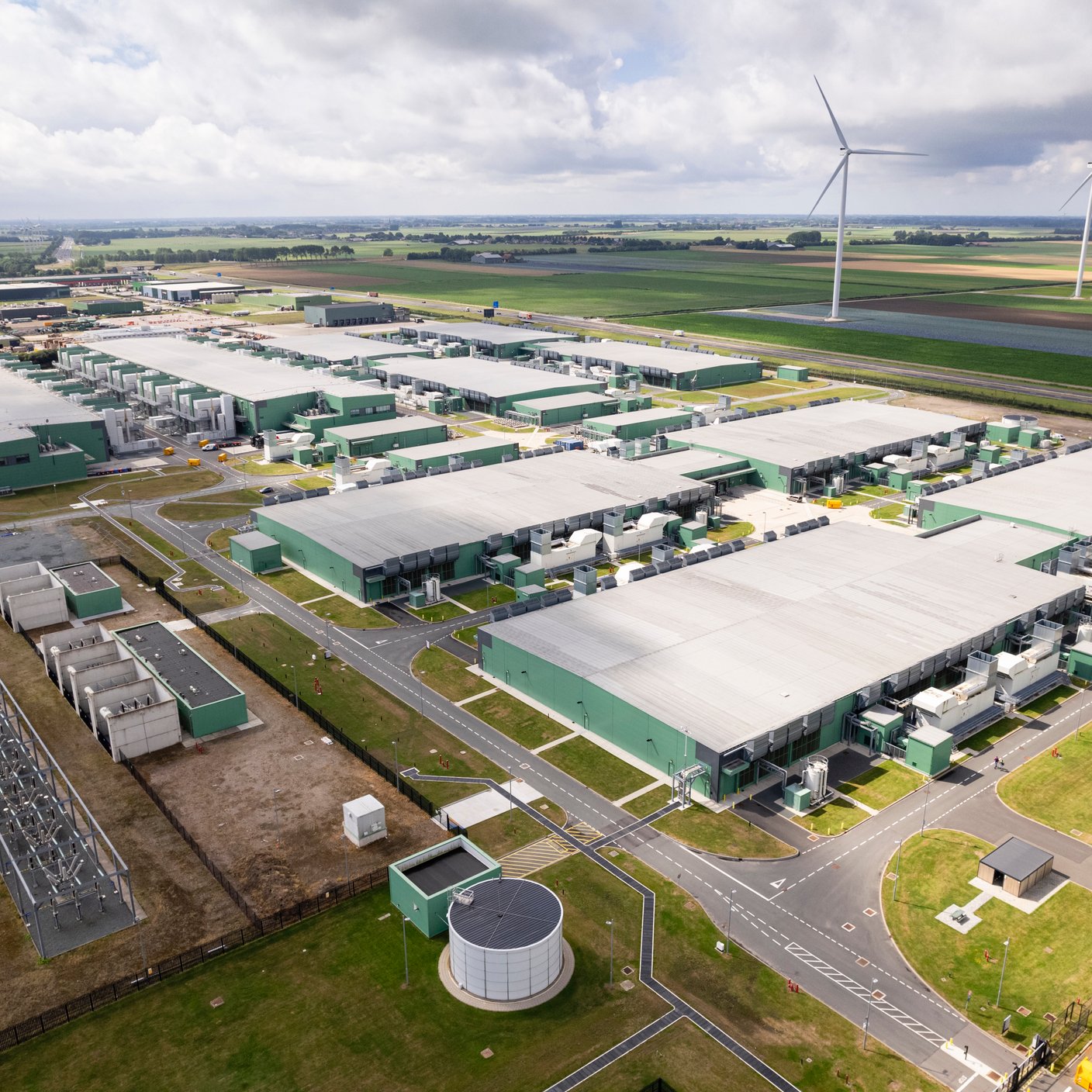 Horizontal color image of a data center from a drone point of view.