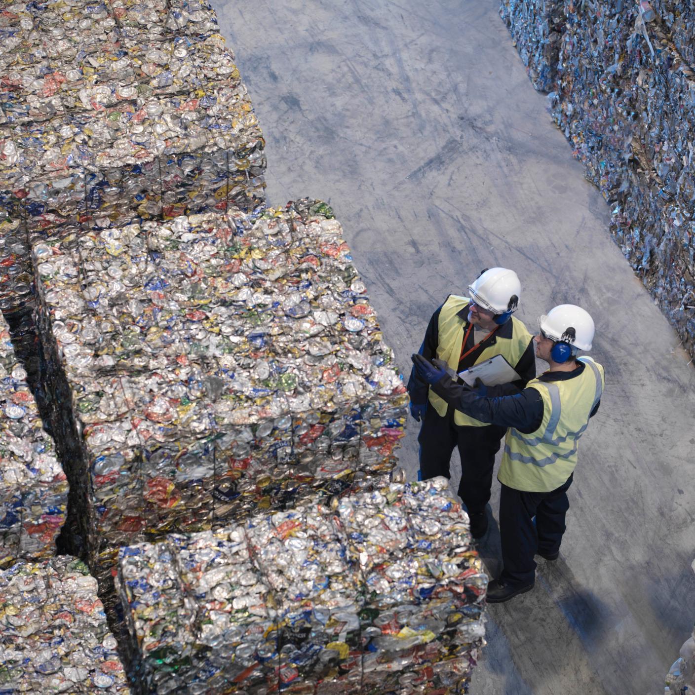Two men discussing waste management