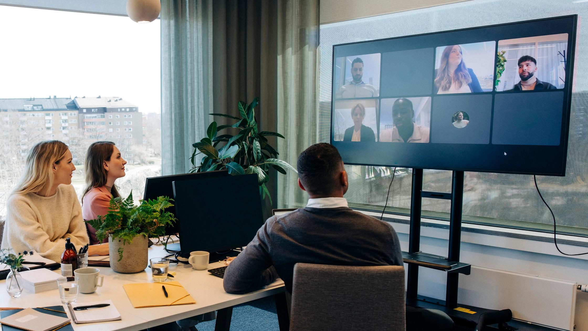 Multiple people in office using zooms calls