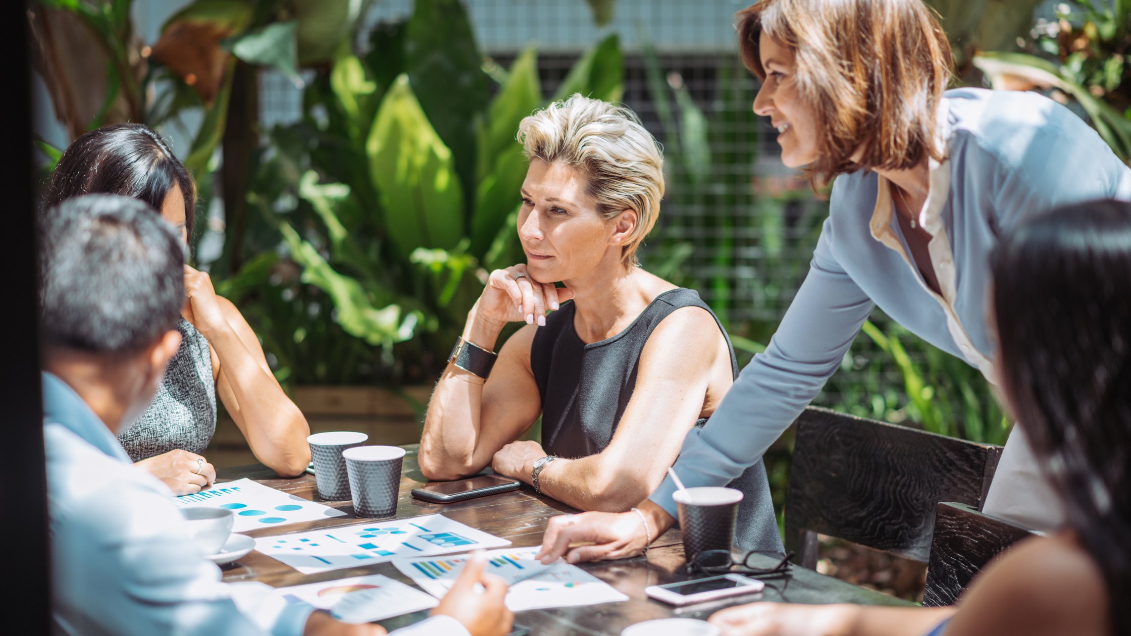 Female boss is finding solutions to overcome the existing problems in company.